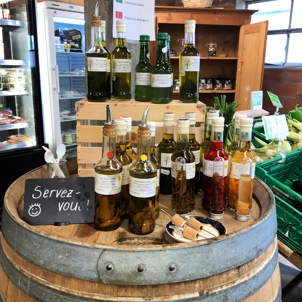 A taste-testing station for olive oils and vinegars at a small grocery store. 