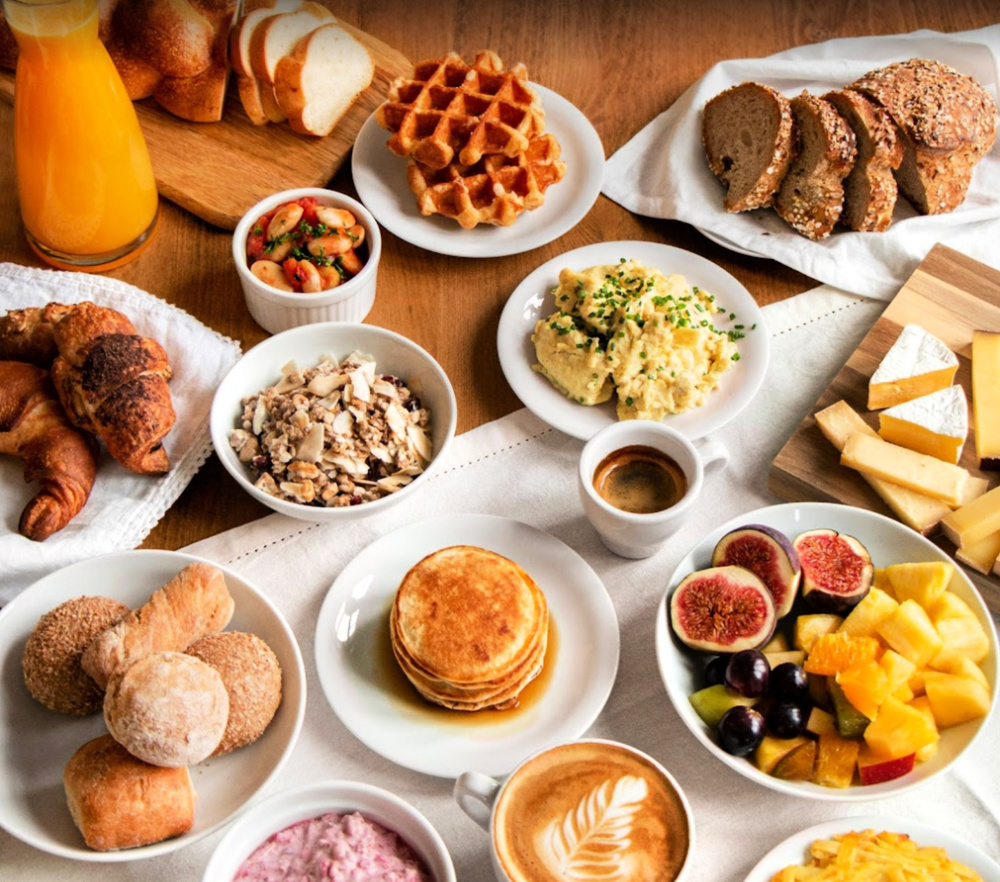 Dishes of food from a vegetarian breakfast buffet.