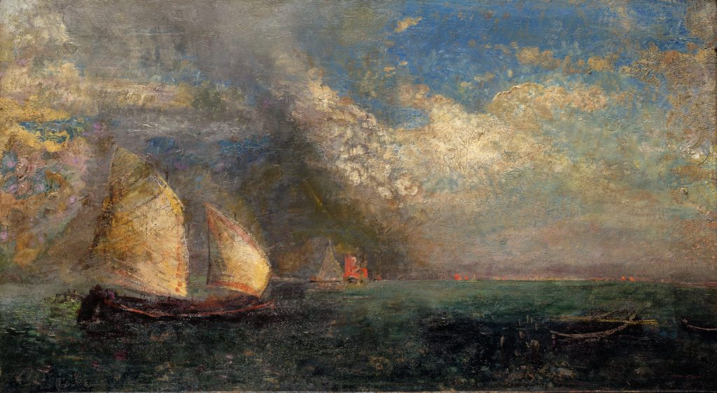 Sailboat on a deep green sea with a blue sky and puffy white clouds.